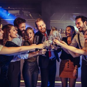 Life is a party once you realize it is Group of friends toasting in the club